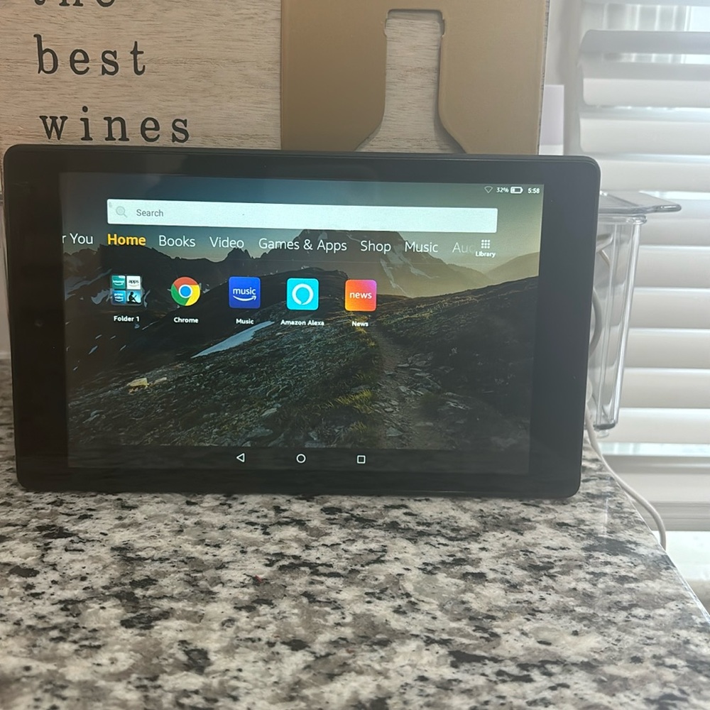 Amazon Fire HD tablet with protective case and charger.